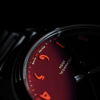 Close up of numerals on Swiss Made mechanical watch with 39mm deep red enamel lacquer dial for men and women designed by Camp Watches in Los Angeles.