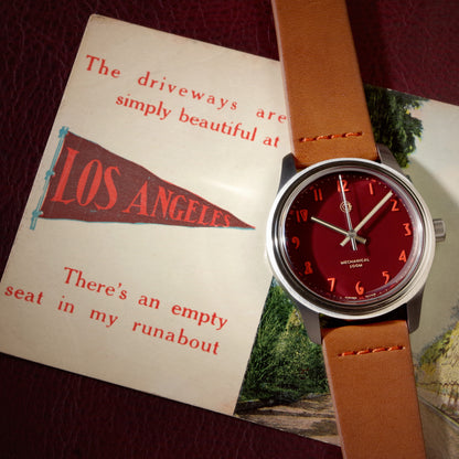 Swiss Made mechanical watch with 39mm deep red enamel lacquer dial for men and women designed by Camp Watches in Los Angeles.